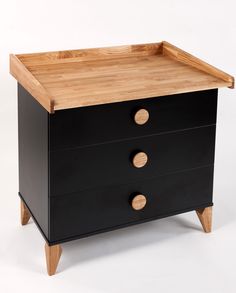 a black and wood dresser with two drawers