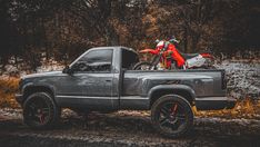 a motorcycle is parked in the back of a truck