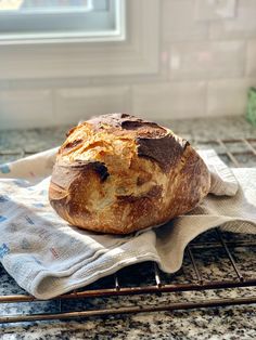 a loaf of bread sitting on top of a towel