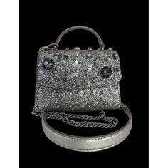 Introducing The Stunning Kate Spade Darcy Top Handle Jeweled Micro Satchel/Crossbody In Silver! This Limited Edition Bag Is Perfect For Any Occasion, Whether It Be A Wedding Or A Cocktail Party. The Bag Features A Magnetic Closure And A Detachable Strap For Versatile Wear. The Exterior Is Made Of Leather And Glitter Fabric, With A Silver Crossbody Strap And Hardware. The Bag Has A Beige Fabric Lining And A Lightweight Design. With A Width Of 6.3", A Height Of 4.6", And A Depth Of 2.2", This Micr Limited Edition Bag, Glitter Fabric, Top Handle, Kate Spade New York, Silver Color, Kate Spade, Satchel, Bag Lady, Pouch