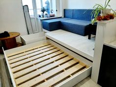 the bed frame is made up and ready to be used as a couch or sofa