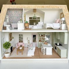 a doll house is shown with furniture and decor on the inside, as well as in the outside