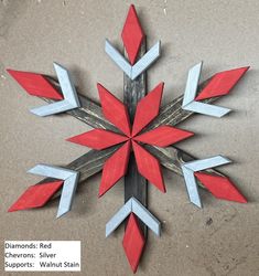 a snowflake made out of red and blue paper