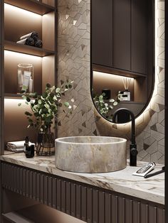 a bathroom sink sitting under a round mirror