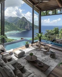 a living room filled with furniture next to a large window covered in glass and overlooking the ocean