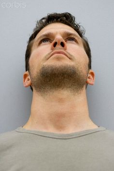 a man looking up with his eyes closed