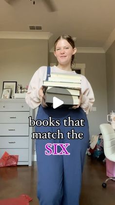 a woman standing in a room with books on her back and the caption reads books that match the six