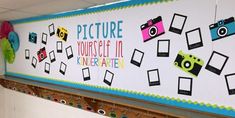 a classroom wall decorated with pictures and magnets