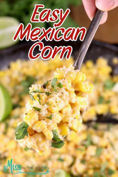 a hand holding a spoon full of mexican corn with the words easy mexican corn above it