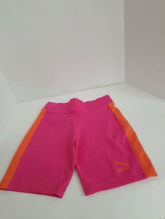 PUMA size XS tight fitting excercise biking shorts.  Bright pink color with orange stripe!  Shipped with USPS First Class Mail Puma Women, Fitness Advice, Workout Shorts, Bright Pink, Bermuda Shorts, Pink Color, Mens Short, Pink And Orange, Tights