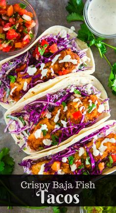 crispy baja fish tacos with cole slaw and cilantro sauce on the side