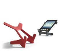 an ipad and tablet holder sitting next to each other