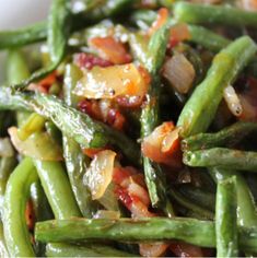 green beans with bacon and onions in a white bowl