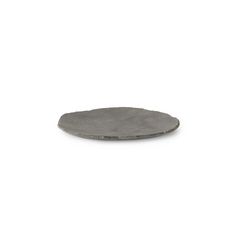 a small metal plate sitting on top of a white surface with no one around it