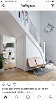 a white stair case next to a wooden floor