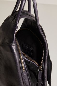 WTF Soho Convertible Bag in Black Indulge in the ultimate luxury with our WTF Soho Convertible Bag in Black. Effortlessly transition from shoulder sling to stylish backpack with zippered details and top handles in soft, supple leather. Part of our exclusive We The Free collection, it's the perfect balance of function and fashion. Commuting Tote Bag With Zipper Closure, Luxury Commuting Bag With Detachable Strap, Chic Commuting Bag With Zipper Closure, Double Handle Bags With Zipper Closure For Commuting, Commuting Bags With Zipper Closure And Double Handle, Black Top Handle Backpack For On-the-go, Black Leather Backpack With Detachable Handle For On-the-go, Black Duffle Bag With Detachable Handle For On-the-go, Black Satchel Backpack With Detachable Handle