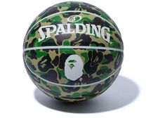 a basketball with the word spalding on it and a gorilla face painted on it