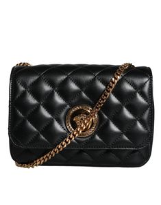 The Versace Black Quilted Lambskin Leather Crossbody Shoulder Bag sports a solid color and features the iconic Versace brand logo in the form of engraved metal hardware. The adjustable shoulder strap, measuring at 110cm, provides versatile styling options for any occasion.   Model: Crossbody bag   Color: Black   Fabric inner lining with inside pocket   Handle: Adjustable shoulder strap   Logo engraved metal hardware   Made in Italy   Measurements: 19cm x 13cm x 7cm   Strap: 110cm Versace Brand, Engraved Metal, Versace Bags, Metal Engraving, Black Quilt, Leather Chain, Quilted Leather, Metal Hardware, Chain Bags