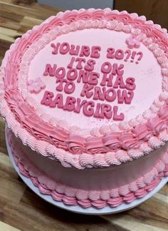 a pink birthday cake with the words you're boy? it's ok no one has to know babygirl