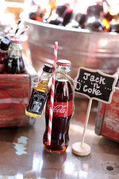 there are two soda bottles with straws in them and a sign that says jack's o'clock