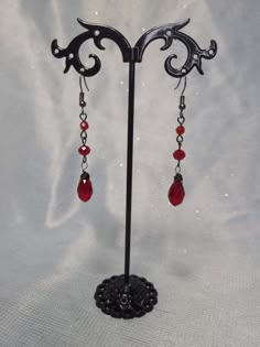 Beautiful red gems on gunmetal black Blood Drip Earrings, Red Silver Earrings, Red Dangly Earrings, Gothic Jewelry Earrings, Ruby Jewelry Silver, Goth Prom Jewelry, Red And Silver Earrings, Red Silver Jewelry, Red Prom Accessories