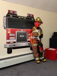 a fireman standing next to a fire truck painted on the wall