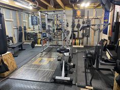 an empty gym with many different equipment