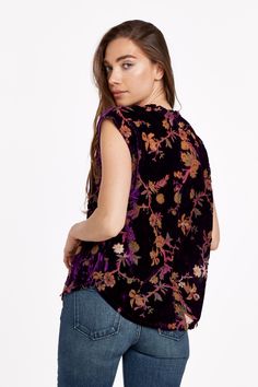 Artisan printed top, frayed neck & hem, v-neck finished sleeveless in floral printed velvet. Elegant floral print finished bold & prestigious! Heavenly beauty of royal blooms... Multi print woven on relaxed fit.Body length from HPS: 26", Bust: 42" (Size Small) 70% VISCOSE 30% NYLON Hand wash cold, Hang to dry Imported Printed Sleeveless Tops For Fall, Imperial Purple, Denim Essentials, Printed Velvet, Dress Guide, Jumpsuit Jacket, Velvet Top, Medium Wash Jeans, Floral Print Tops