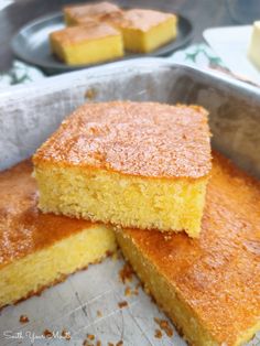 three pieces of cake in a pan on a table