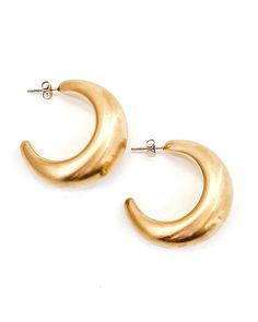 Our Enoch Matte Gold Earrings are the perfect touch of luxe to transform any look. Exquisitely crafted in a matte gold tone, these statement earrings add a sophisticated and unique element to any ensemble. Crafted with waterproof material, these earrings are perfect for any occasion - rain or shine! Brushed, Matte Gold finish 2 sizes to choose from Waterproof Tarnish resistant 18K Gold plated stainless steel Hypoallergenic Elegant Crescent Brass Hoop Earrings, Elegant Crescent Shaped Brass Hoop Earrings, Gold Crescent Brass Earrings, Modern Gold Jewelry With Matte Finish, Modern Matte Finish Gold Jewelry, Elegant Crescent Brass Earrings, Modern Gold Crescent Earrings, Gold Matte Finish Jewelry Gift, Matte Finish Gold Jewelry Gift