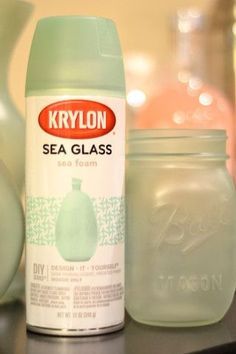 a bottle of krylon sea glass next to some jars