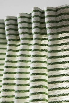 green and white striped curtain with vertical stripes