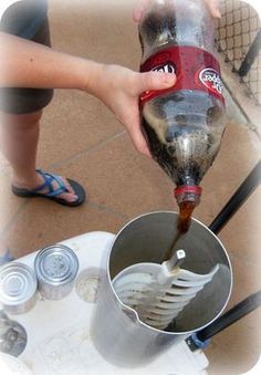 a person pouring something into a cup