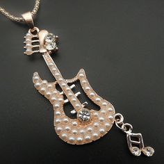 327 Nwot Pearl And Crystal Guitar Pendant Necklace A Cute Music Note Hangs From The End Of The Guitar. Chain - 27" L With 2" Extension Pendant - 3.5" L (Includes Bale And Note) X 1" W All Measurements Are Approx. Comes Boxed.. Guitar Pendant, Music Note Necklace, Cute Music, Guitar Music, Music Note, Music Notes, Pearl Jewelry, Womens Jewelry Necklace, The End