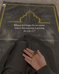 a woman's hand resting on the back of her pants with an islamic quote