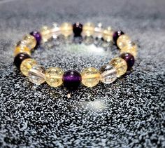 This Chakra Healing Bracelet features the natural gemstones, Citrine, Amethyst and Clear Crystal Quartz. Citrine has positive, radiant vibrations that uplift your spirit and help motivate you when wearing it. Citrine is the stone of success, abundance and prosperity. It helps to raise your self esteem and brings good luck to any business or finance endeavors. Crystal Quartz provides clarity of the mind and thoughts. It raises your vibrations, balances your auric field and is great for initiating Crystal Protection, Auric Field, Healing Gemstone Bracelets, Citrine Bracelet, Bracelets Design, Beads Bracelet Design, Les Chakras, Crystal Beads Bracelet, Bracelet Design