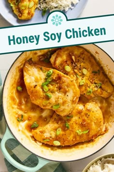 a pan filled with chicken and rice on top of a table next to a sign that says honey soy chicken