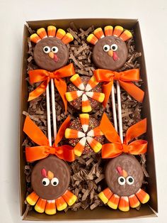 a box filled with cookies and candy decorated like turkeys