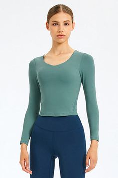 Sizing: Slim fit Pattern: Solid Features: Long sleeve. removable bra pads. fitness wear Necline: Round neck Sheer: No Stretch: Highly stretchy Product measurements: 4: length 17 in. bust 28 in. hem 26 in. sleeve 21 in6: length 18 in. bust 30 in. hem 27 in. sleeve 22 in8: length 18 in. bust 31 in. hem 29 in. sleeve 22 in10: length 19 in. bust 33 in. hem 30 in. sleeve 22 in12: length 19 in. bust 35 in. hem 32 in. sleeve 23 in Material composition: 80% nylon. 20% spandex Care: Machine wash cold... V-neck Elastane Activewear For Workout, Elastane Long Sleeve Activewear, Seamless Long Sleeve Sportswear, Long Sleeve Elastane Activewear For Gym, Versatile Breathable Tops, Versatile Breathable Elastane Tops, Fitted Long Sleeve Elastane Activewear, Seamless Long Sleeve Activewear For Gym, Stretch Elastane V-neck Activewear