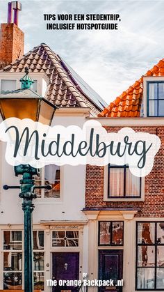 a street light in front of a building with the words middelburg on it