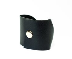 "Noir Black Bow Tie Vegan Leather Wide Cuff Bracelet by ForgottenCotton Because we know that Bow Ties are cool. Our noir black bow tie cuff is perfect 'oh so adorable' accessory. Dressed up or down, it is versatile, cute, and sure to get tons of compliments. Why we love it: Our cuffs are made to be versatile. You can wear our cuffs on either your wrist or your scarf (or both!) We chose high quality vegan leather that has the look and feel of leather without the guilt. Hand stitched to perfection Black Cuff Leather Bracelet Gift, Black Band Leather Cuff Bracelet Gift, Gift Leather Cuff Bracelet With Black Band, Adjustable Cuff Bracelet Fashion Accessory, Adjustable Cuff Wristband, Adjustable Cuff Leather Bracelet, Black Cuff Bracelet As Gift, Black Cuff Bracelet Gift, Adjustable Leather Strap Cuff Bracelet