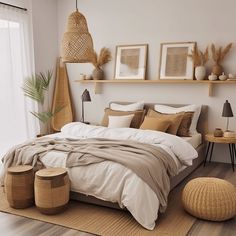 a bedroom with white walls and wooden flooring is decorated in neutral colors, including beige