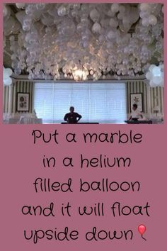 a man sitting in a room with balloons on the ceiling and a quote written below