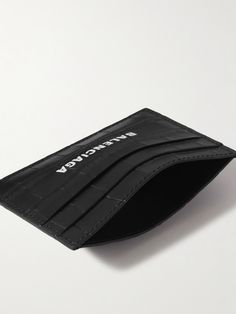 The croc-effect leather used to make Balenciaga's cardholder has a bit of a vintage vibe to it. Stamped with logo lettering, it has four slots for cards and a slim central compartment for folded receipts. Balenciaga Men, Black Balenciaga, Leather Cardholder, Leather Billfold, Balenciaga Logo, Balenciaga Black, Billfold Wallet, Black Wallet, Monogrammed Leather