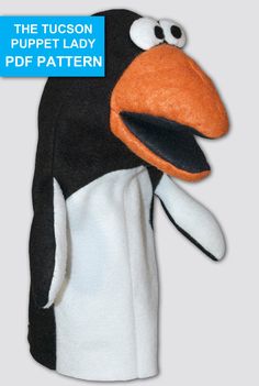 the puppet lady penguin is wearing a black and white outfit