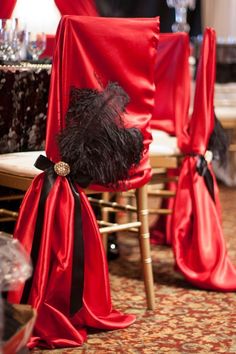 red chairs with black sashes and bows on them