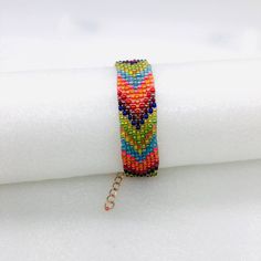 Chevron Beaded Cuff ~ Rose Gold ~ Artisan Made Primarily Coral, Olive And Blue Rose Gold Tone Findings, Lobster Clasp Adjustable 6 1/2'' To 9'' Hand Made By Me! Gift Box Included New In Box Trendy Multicolor Woven Beaded Bracelets, Summer Festival Woven Beaded Bracelets, Multicolor Beaded Chain Bracelets For Party, Colorful Bohemian Beaded Bracelets For Party, Handmade Summer Beaded Bracelets, Bohemian Multicolor Beaded Bracelets For Spring, Multicolor Bohemian Bracelet For Spring, Colorful Bohemian Beaded Bracelets For Spring, Multicolor Bohemian Beaded Bracelets