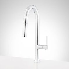 the faucet is attached to the sink in this modern style kitchen setting with stainless steel fixtures