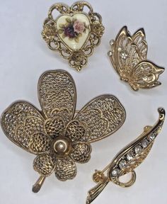 Vintage Gold Tone Rhinestone Enamel Heart Filigree Wearable Brooch Pin Lot (4) | eBay Gold Enamel Costume Jewelry Brooches, Collectible Gold Brooches With Rhinestones, Victorian Rhinestone Brooches For Gifts, Victorian Style Rhinestone Brooches As Gift, Gold Enamel Wedding Brooch, Vintage Enamel Wedding Brooches, Gold Enamel Wedding Brooches, Vintage Gold Brooches With Rhinestones, Vintage Gold Enamel Brooches