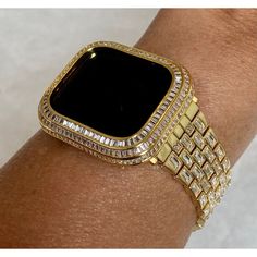 Fits the Apple Watch available for sizes 40mm and 44mm in series 4,5,6 or SE. Custom Apple Watch Bezel Cover with 3 gleaming rows of high quality lab diamond baguettes set in 14k Gold plating. Two bars on the back hold the cover in place, one opens making it easy to get on and off. Access to all button. Fits all Series 4,5,6,SE The listing is for the bezel cover only, there is no band. **Apple Watch is not include used for photo shoot only** For band color selections click the appropriate link S Apple Watch Cover, Gold Apple Watch Band, Custom Apple Watch Bands, Apple Band, Gold Apple Watch, Diamond Baguette, Gold Apple, Ceramic Watch, Apple Watch Case